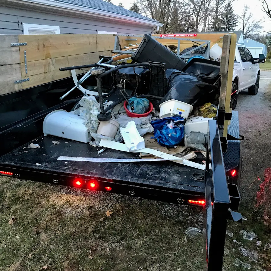 Roll-off dumpster delivered to a residential driveway in Alsace