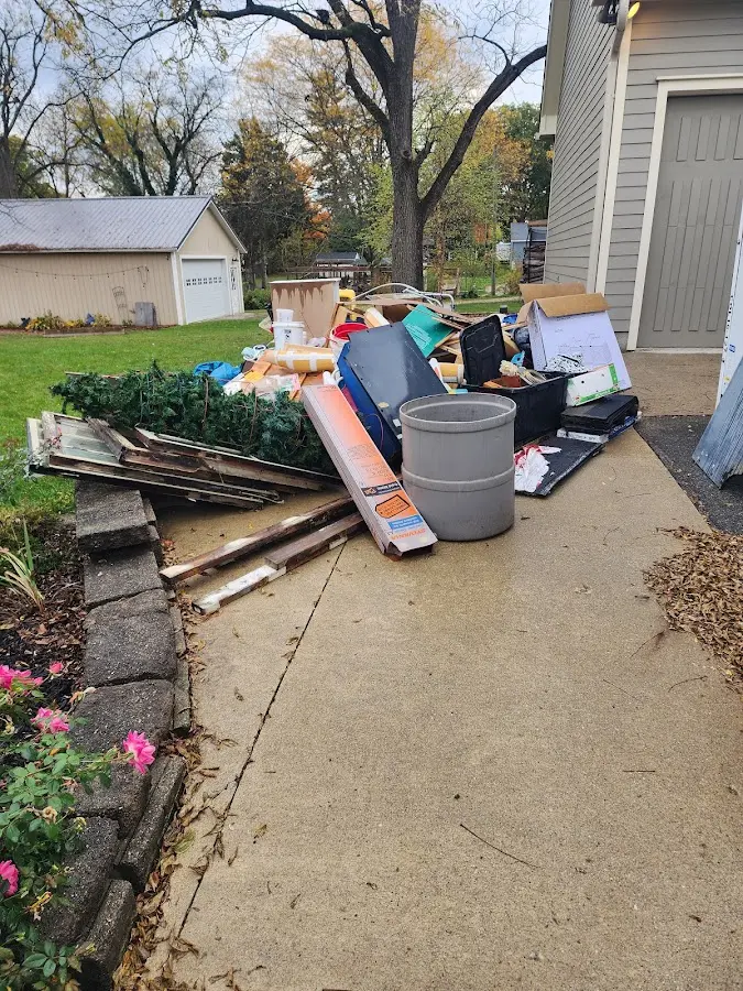 Dumpster being loaded with debris for Roofing Dumpster Rental in Alsace
